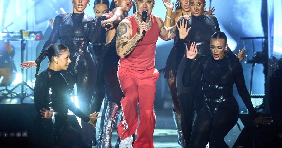 Robbie Williams durante un concierto